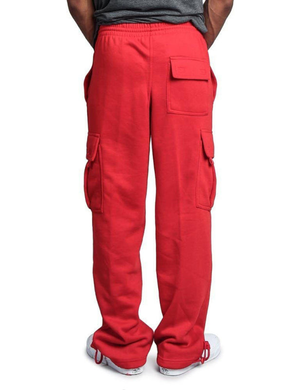 Pantalones cargo holgados con múltiples bolsillos y cintura elástica de color liso para hombre 